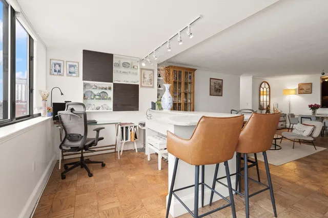 a view of a livingroom with workspace and a couch