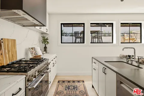 a kitchen with a stove and a sink