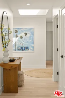 a room with painting and a table