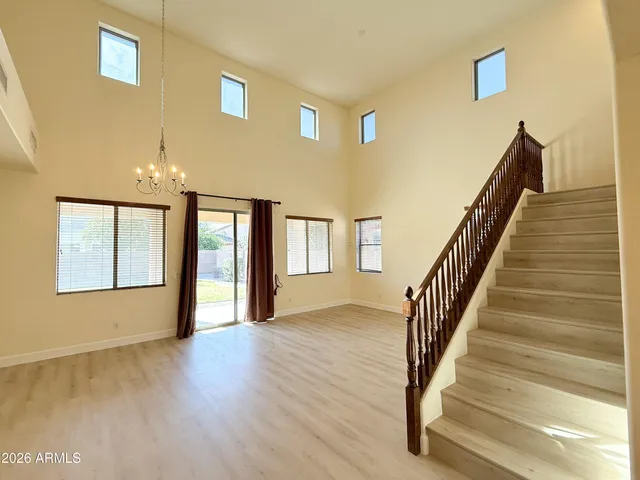 a view of an entryway with wooden floor and windows
