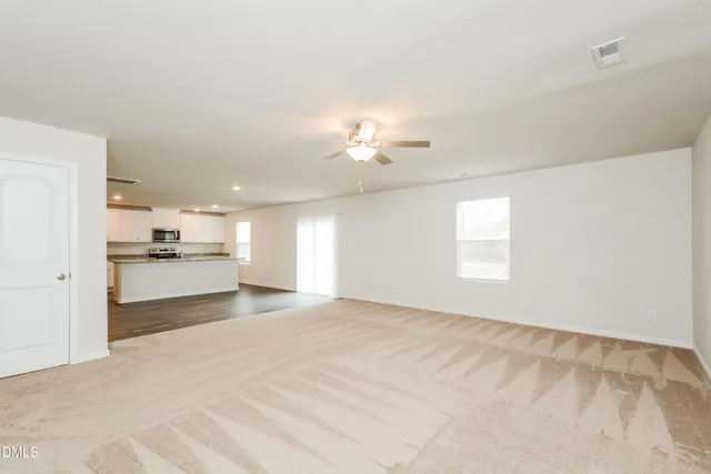 a view of a kitchen with a sink cabinets and a window