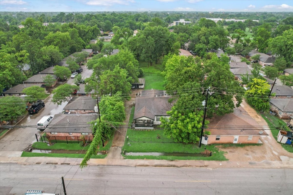 315 East Whitney Street Houston, TX 77022 - Photo 18 of 37 an aerial view of a house with a yard and lake view