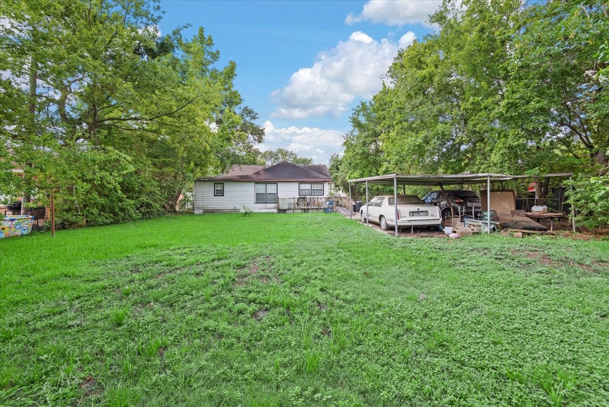 315 East Whitney Street Houston, TX 77022 - Photo 34 of 37 a view of a house with backyard sitting area and garden