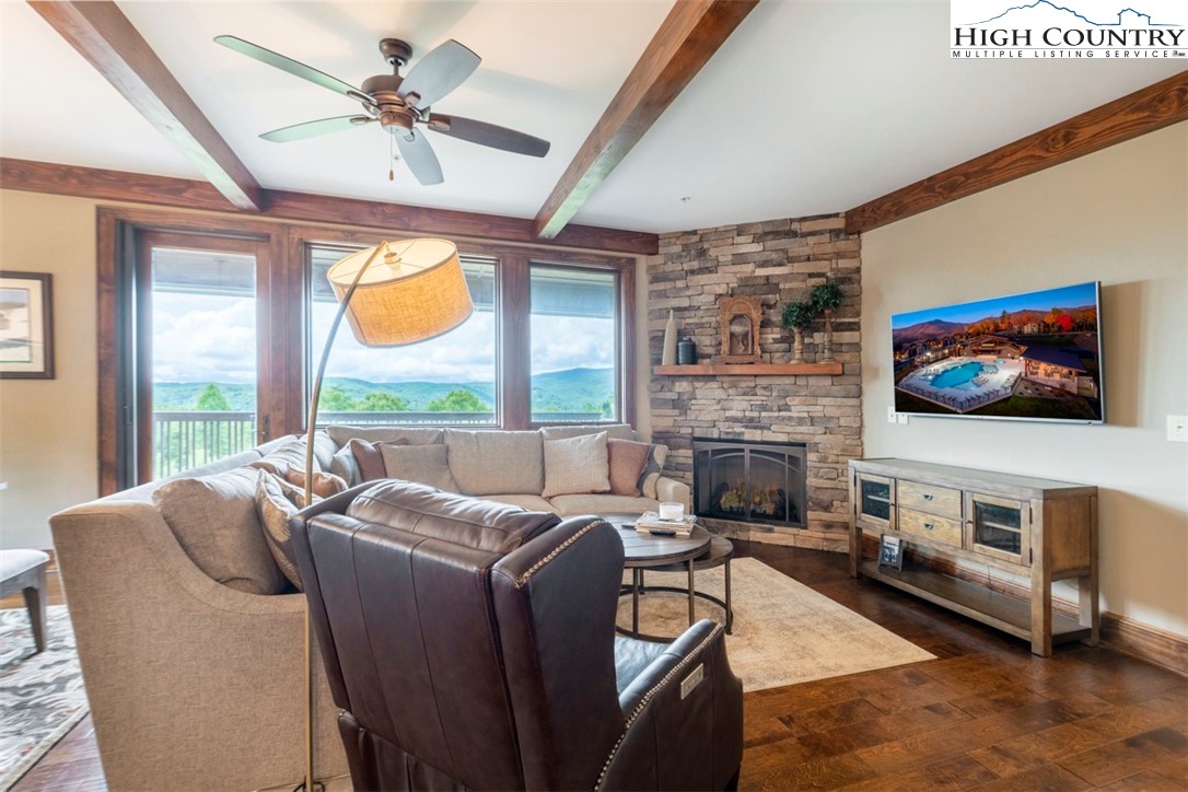 171 Falcon Trace, Unit C411 Boone, NC 28607 - Photo 1 of 46 a living room with furniture a fireplace and a flat screen tv