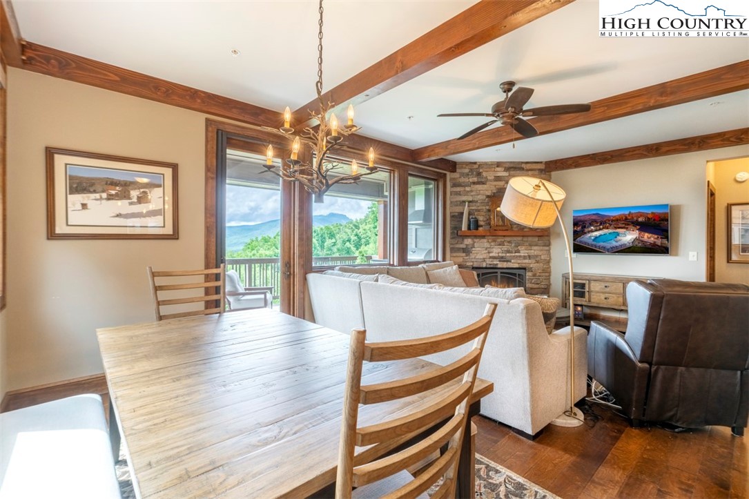 171 Falcon Trace, Unit C411 Boone, NC 28607 - Photo 12 of 46 a living room with fireplace furniture and a flat screen tv