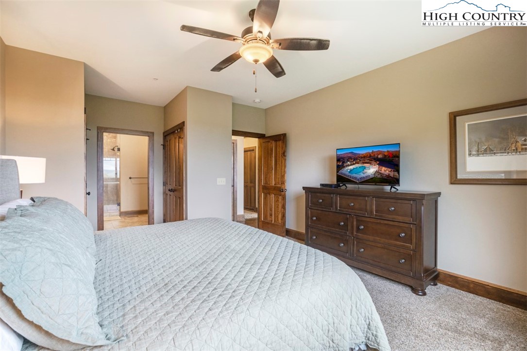 171 Falcon Trace, Unit C411 Boone, NC 28607 - Photo 27 of 46 a bedroom with a bed and a dresser