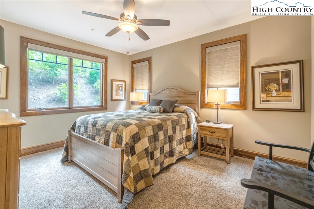 171 Falcon Trace, Unit C411 Boone, NC 28607 - Photo 33 of 46 a bedroom with a bed chair and a window