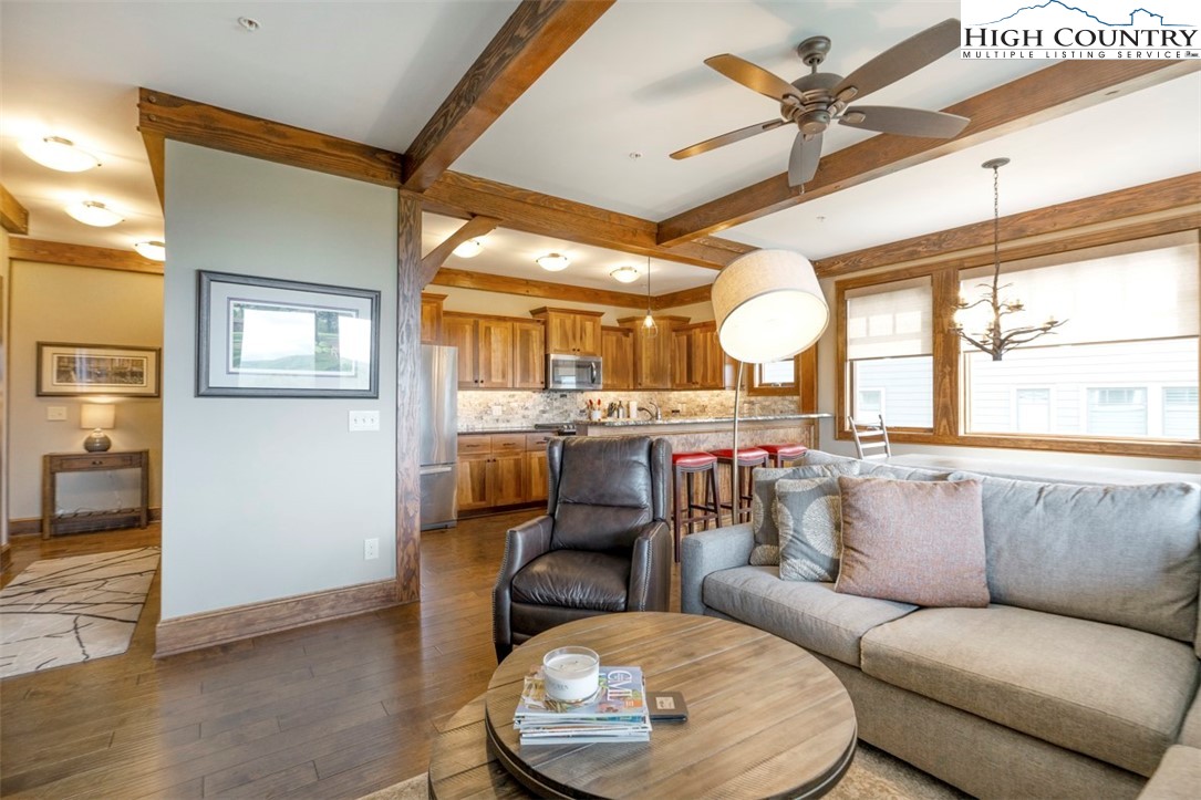 171 Falcon Trace, Unit C411 Boone, NC 28607 - Photo 5 of 46 a living room with furniture and a large window