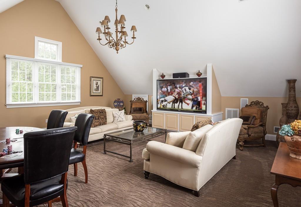 77 Hiller Road Rochester, MA 02770 - Photo 17 of 33 a living room with furniture a chandelier and a window
