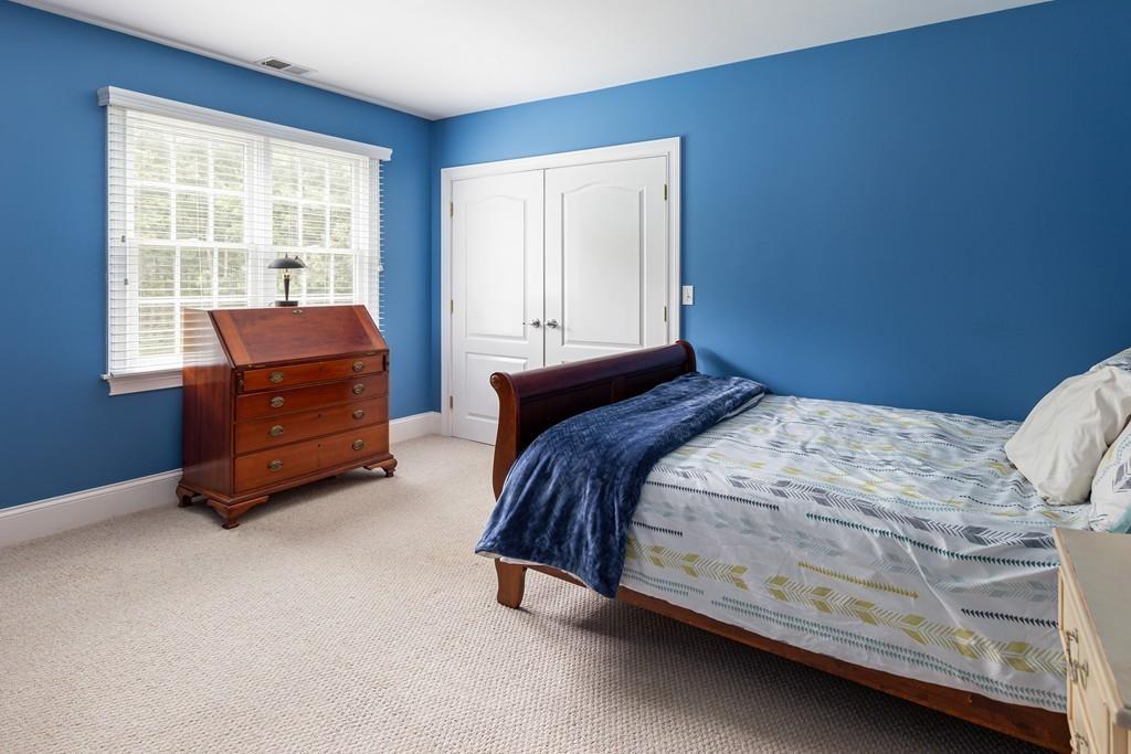 77 Hiller Road Rochester, MA 02770 - Photo 24 of 33 a bedroom with a bed and two windows
