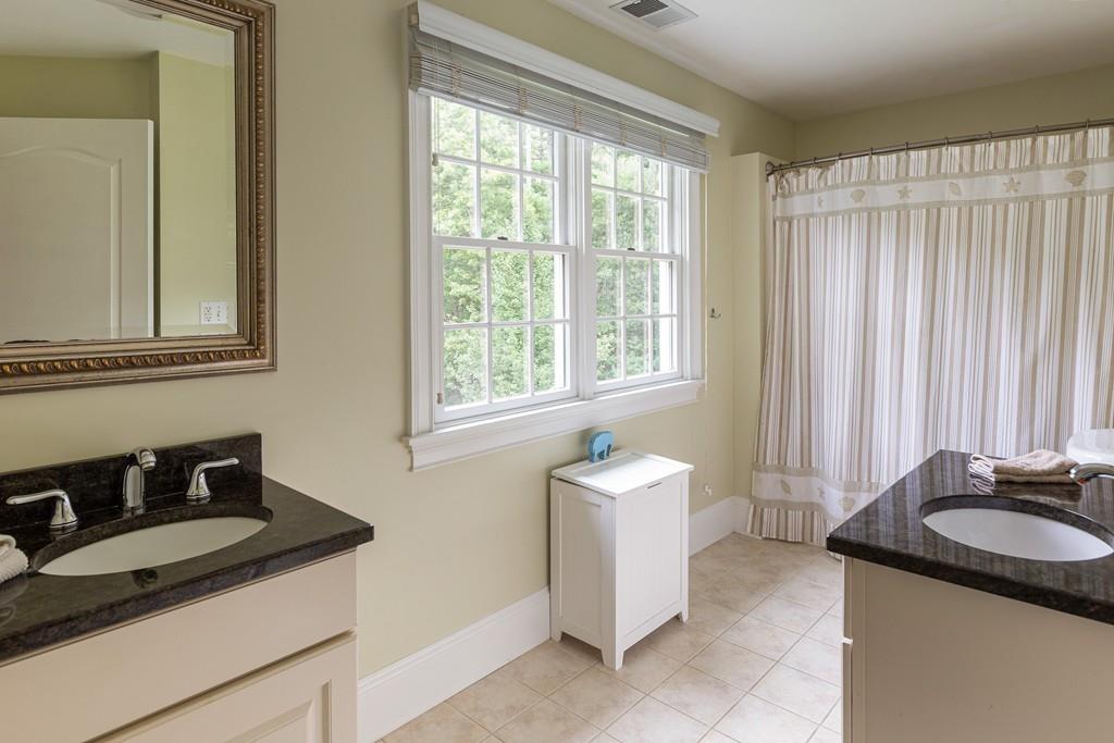 77 Hiller Road Rochester, MA 02770 - Photo 27 of 33 a bathroom with a sink and a mirror