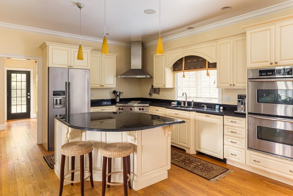 77 Hiller Road Rochester, MA 02770 - Photo 4 of 33 a kitchen with stainless steel appliances granite countertop a stove a sink and a refrigerator