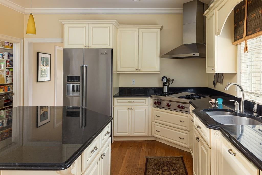 77 Hiller Road Rochester, MA 02770 - Photo 6 of 33 a kitchen with a sink stove and refrigerator