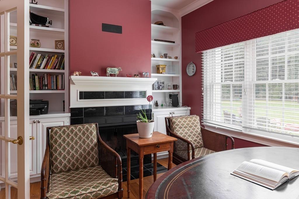77 Hiller Road Rochester, MA 02770 - Photo 8 of 33 a dining room with furniture and a book shelf