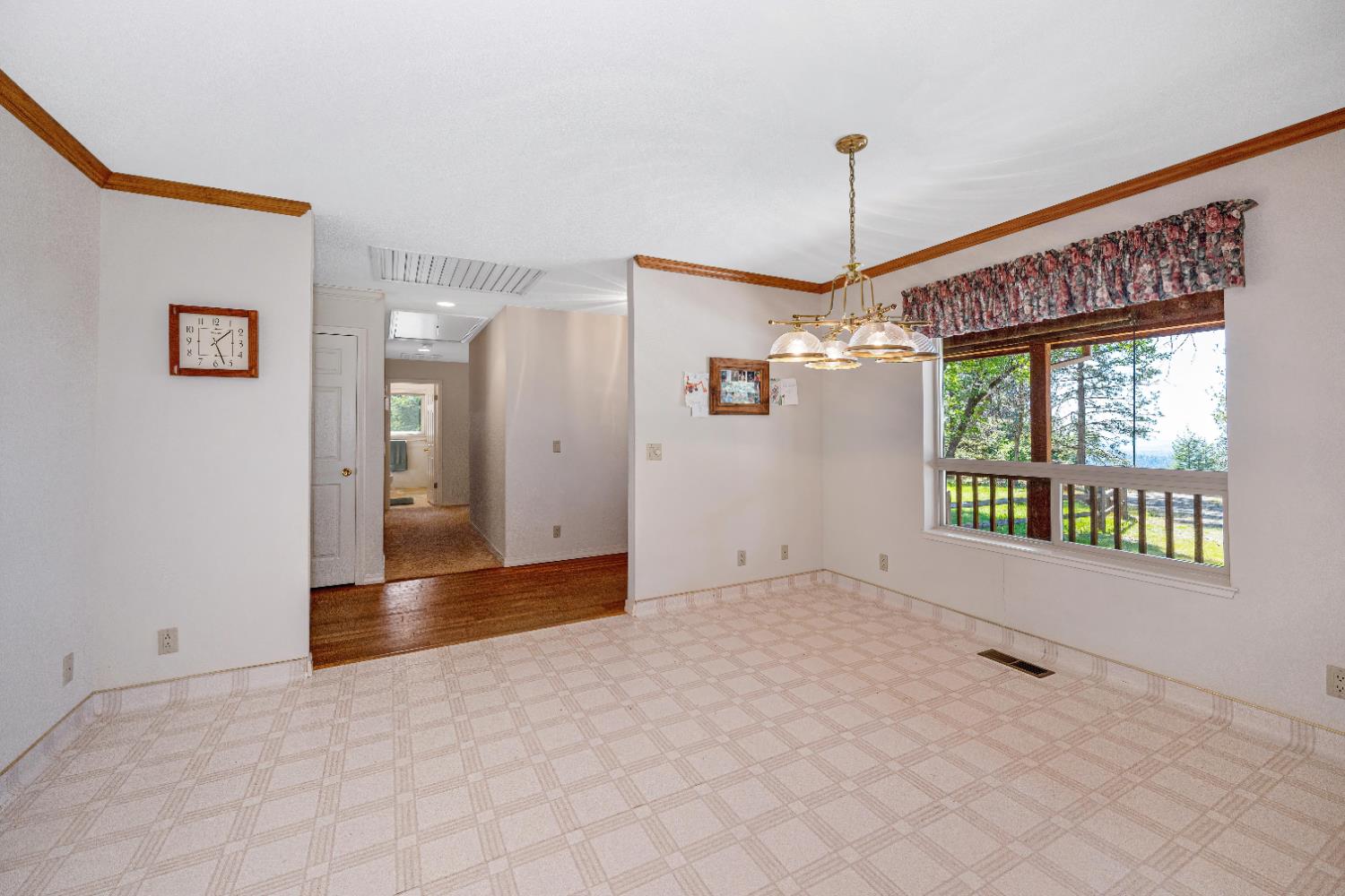 5215 Faraway Road Greenwood, CA 95635 - Photo 12 of 46 spare room featuring ornamental molding and suspended lighting