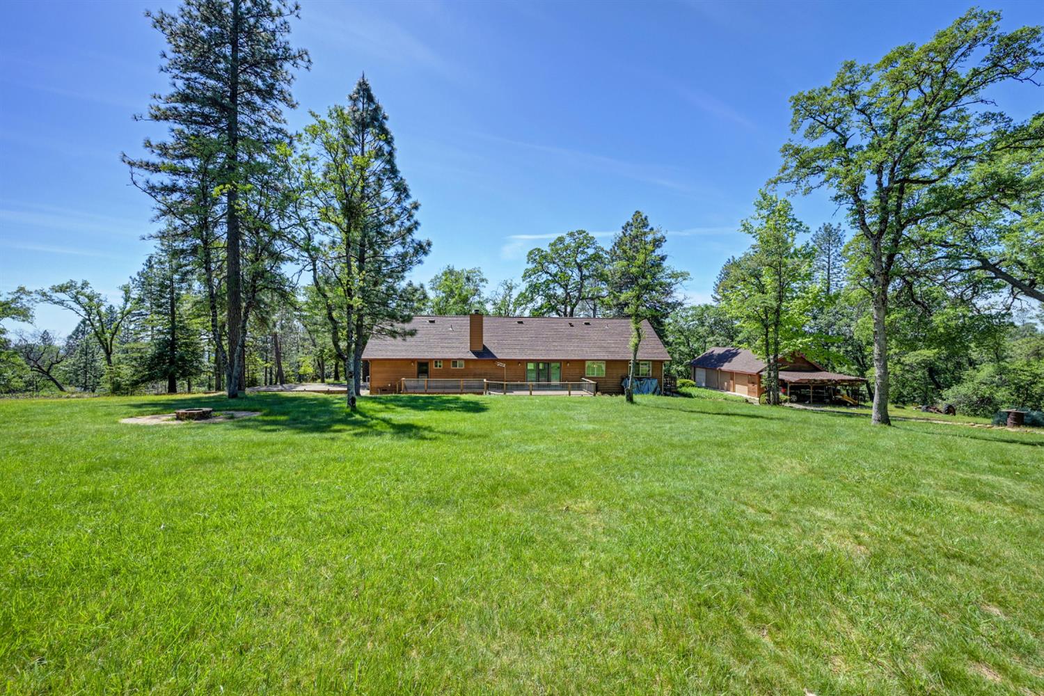 5215 Faraway Road Greenwood, CA 95635 - Photo 38 of 46 back of property with a lawn, view of scattered trees, and a shingled roof
