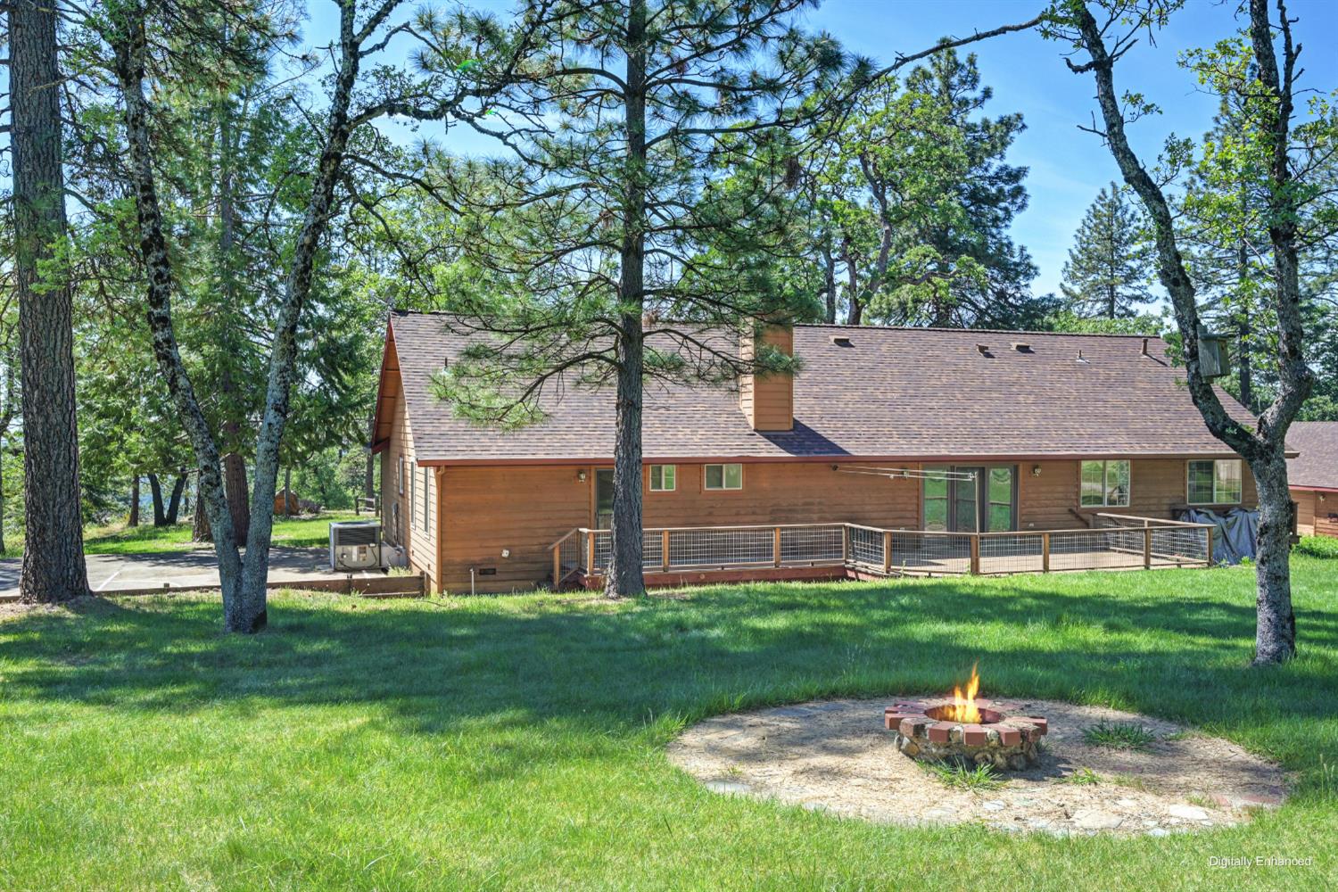 5215 Faraway Road Greenwood, CA 95635 - Photo 39 of 46 rear view of house with a lawn, an outdoor fire pit, a deck, and roof with shingles