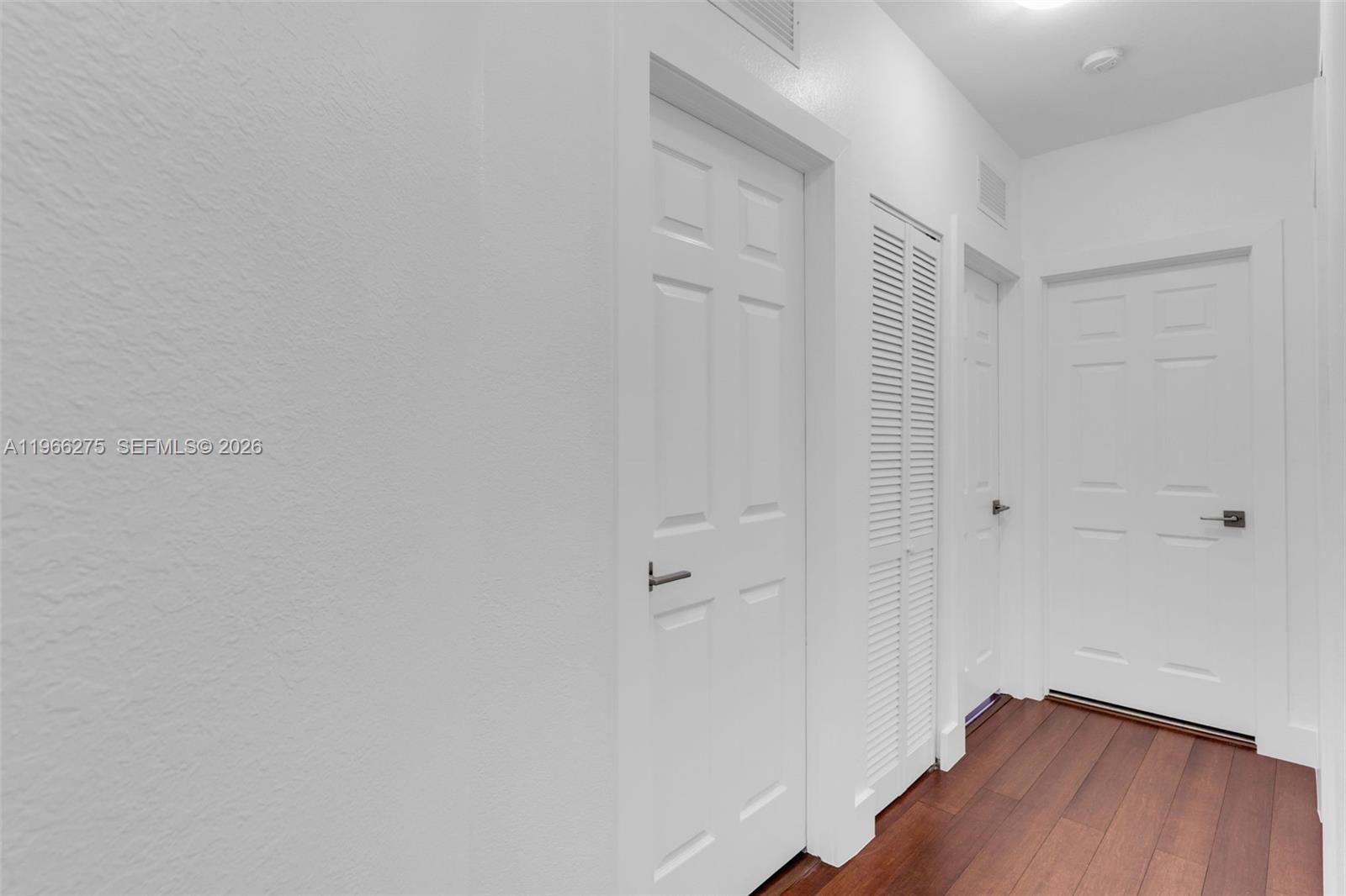 30 Southeast 6th Road Homestead, FL 33030 - Photo 16 of 34 a view of a hallway with wooden floor