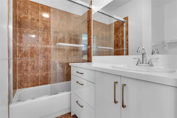 a bathroom with a sink and a bathtub