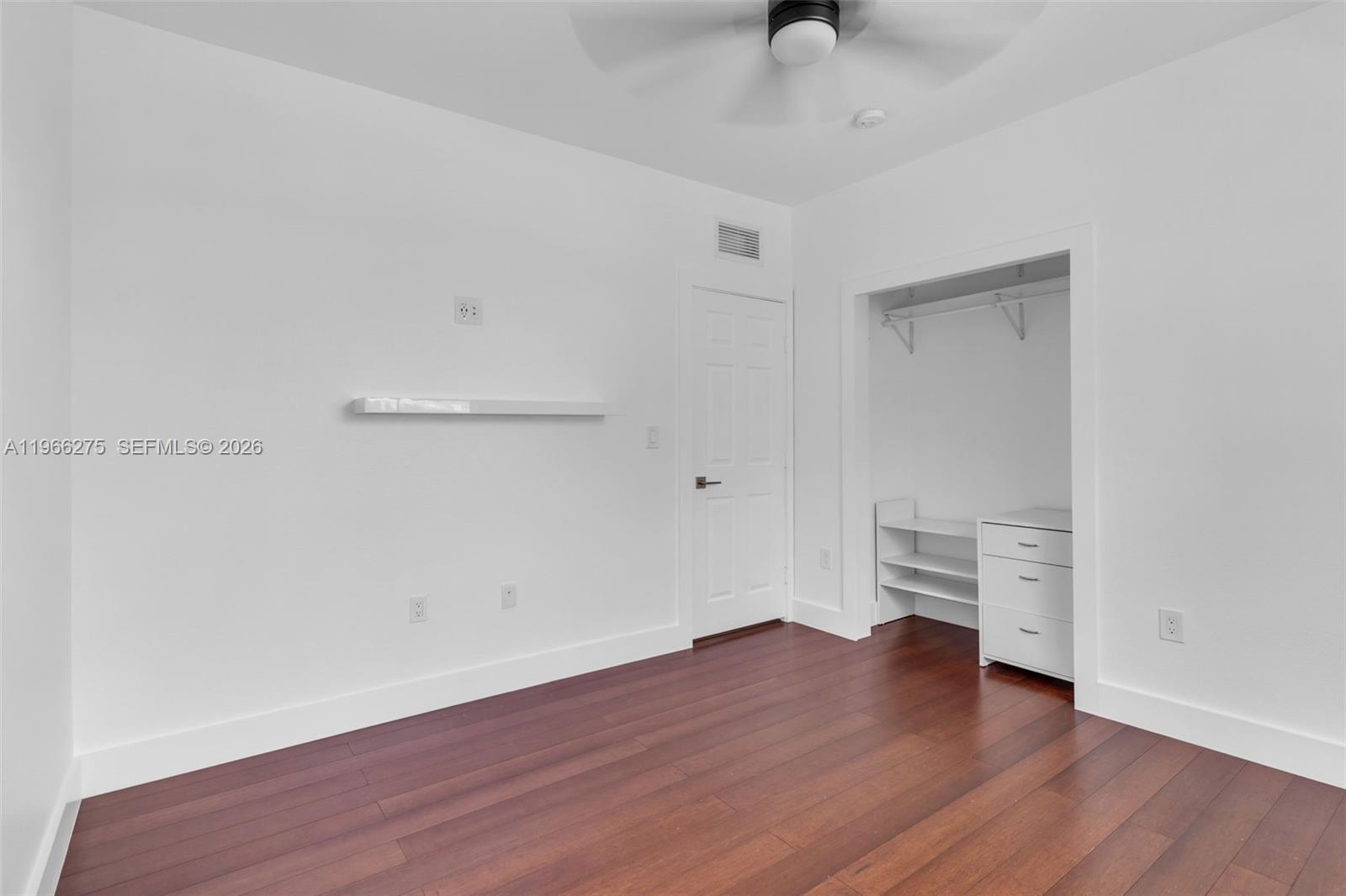 30 Southeast 6th Road Homestead, FL 33030 - Photo 24 of 34 a view of empty room with wooden floor