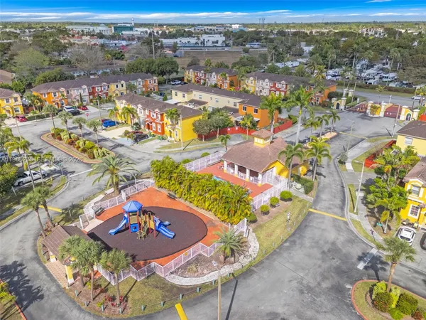 an aerial view of residential houses with outdoor space