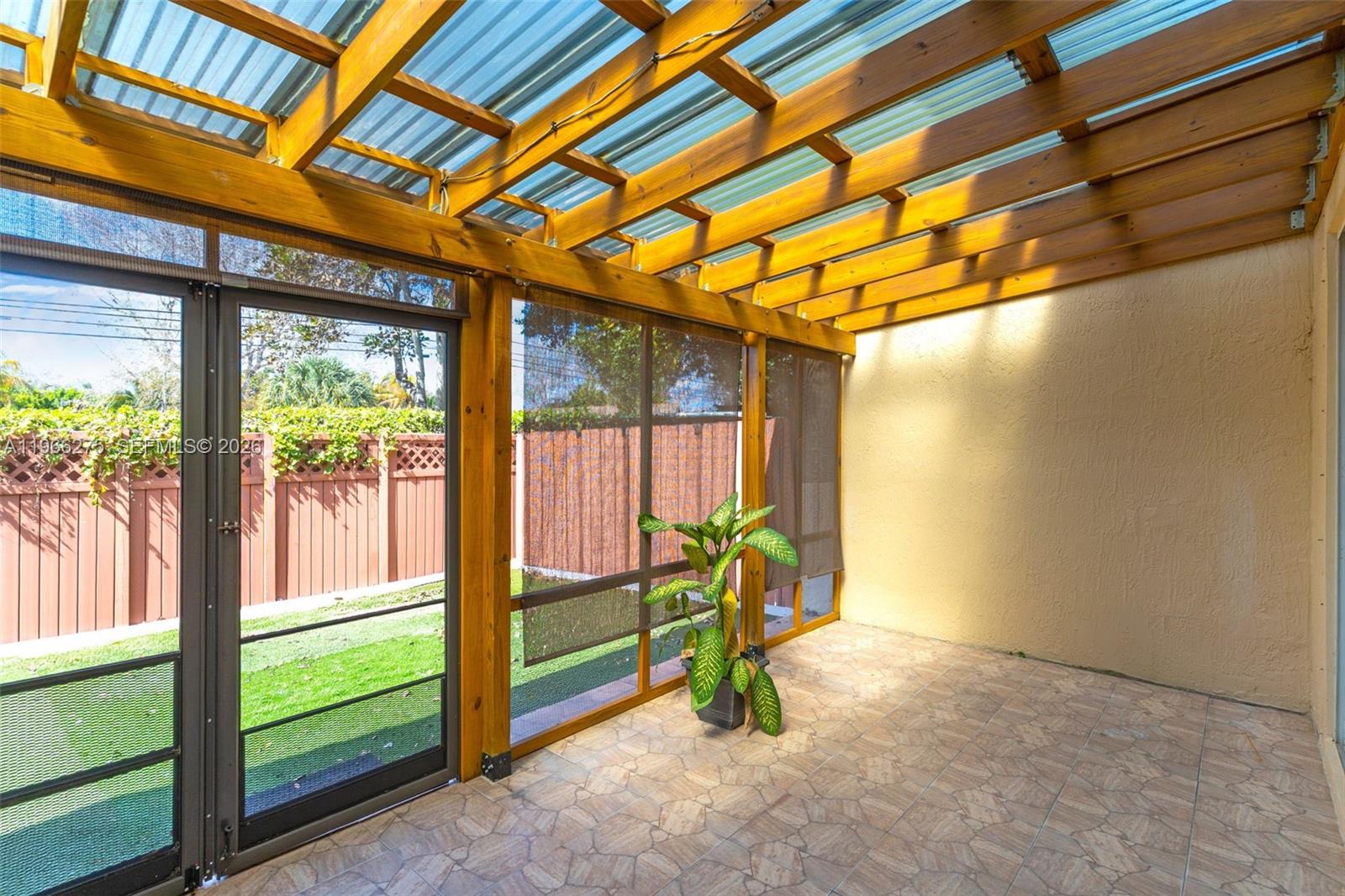 30 Southeast 6th Road Homestead, FL 33030 - Photo 5 of 34 a view of an empty room with a window