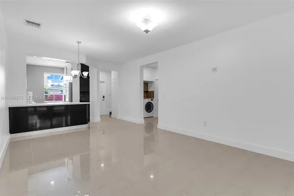 a view of a living room with a large window