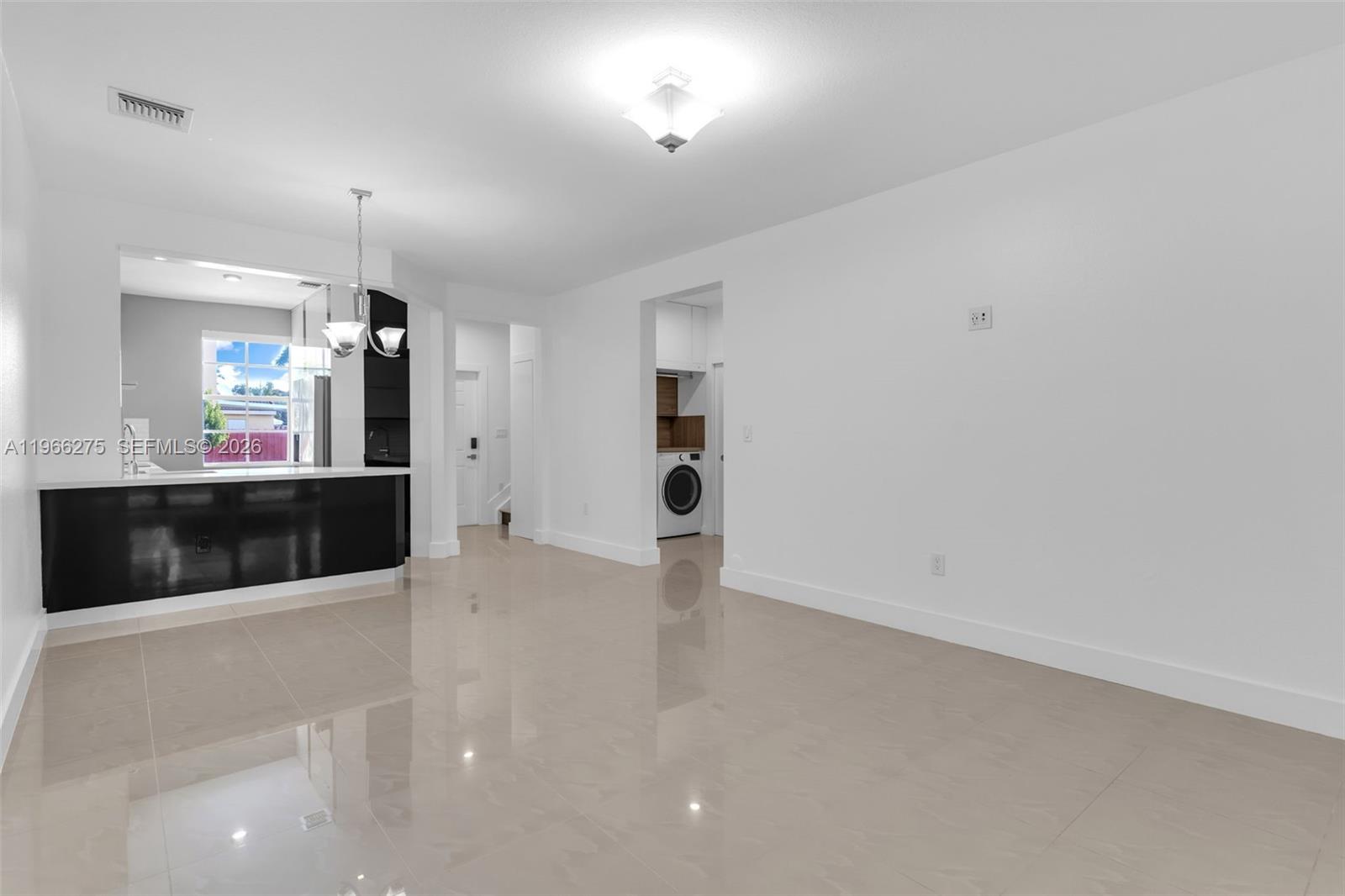30 Southeast 6th Road Homestead, FL 33030 - Photo 7 of 34 a view of a living room with a large window
