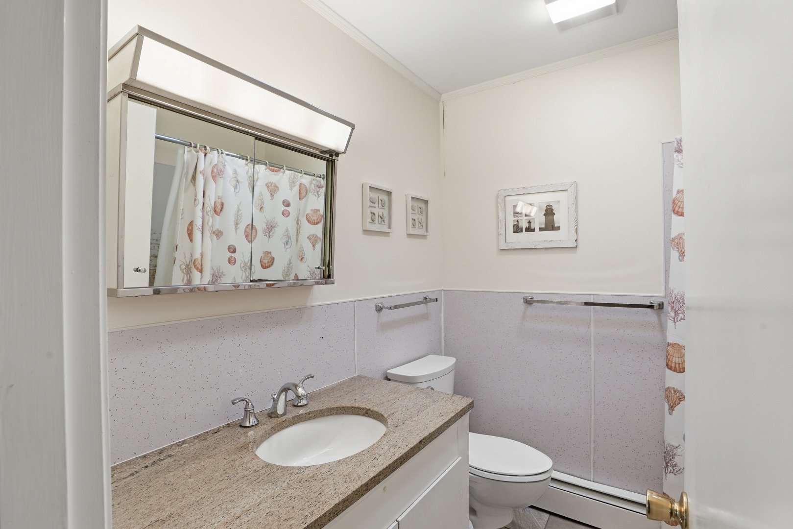 10 Pease Point Road Edgartown, MA 02539 - Photo 12 of 21 a bathroom with a granite countertop sink toilet and a mirror