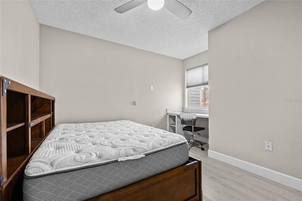 2601 Southwest Archer Road, Unit 334 Gainesville, FL 32608 - Photo 19 of 31 a bedroom with a bed and a window