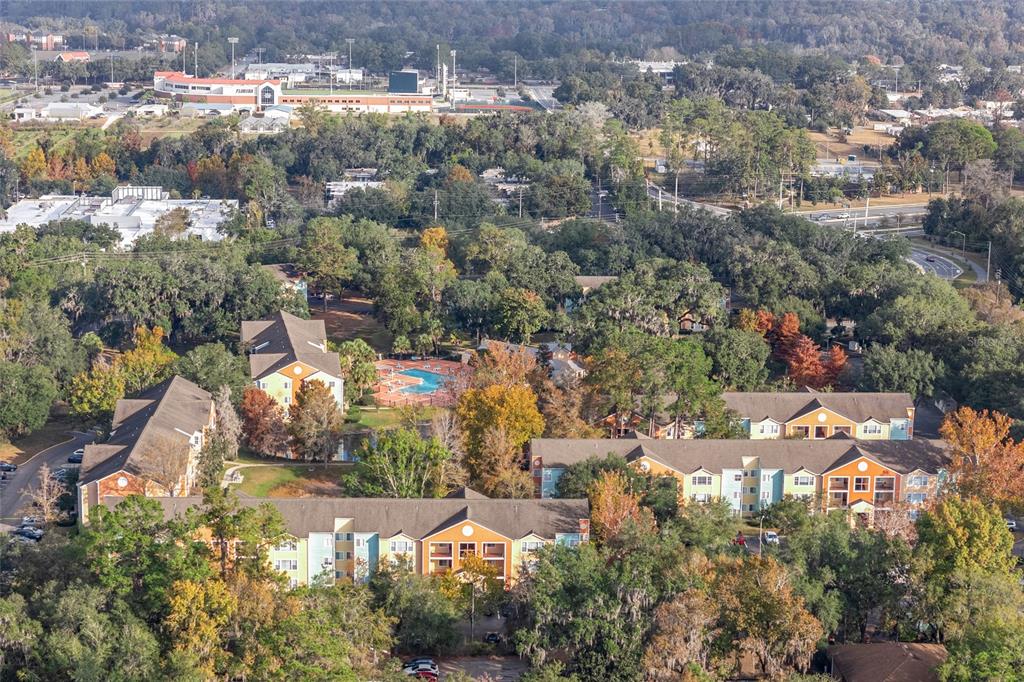 2601 Southwest Archer Road, Unit 334 Gainesville, FL 32608 - Photo 28 of 31 an aerial view of residential houses with yard