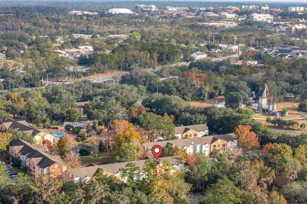 2601 Southwest Archer Road, Unit 334 Gainesville, FL 32608 - Photo 29 of 31 an aerial view of residential houses with outdoor space