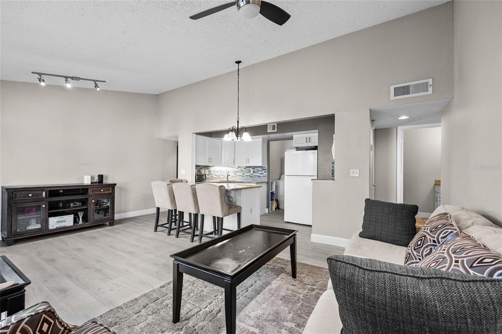 2601 Southwest Archer Road, Unit 334 Gainesville, FL 32608 - Photo 5 of 31 a living room with furniture and a dining table