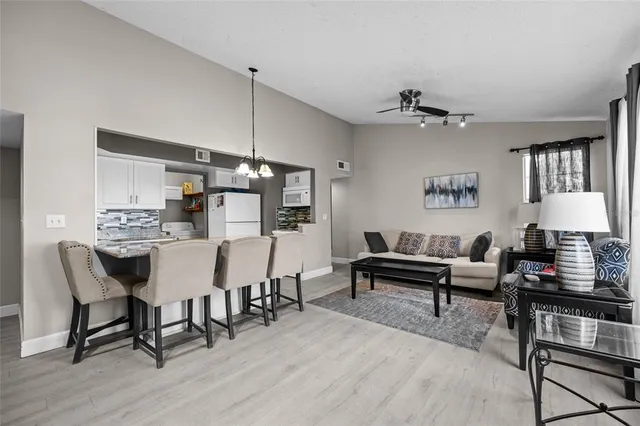 a living room with furniture and a table