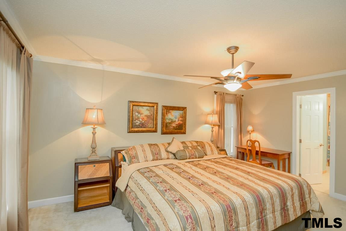 8101 Winstone Court Raleigh, NC 27615 - Photo 11 of 25 First floor master suite with walk in closet and spa bath. Master Bedroom