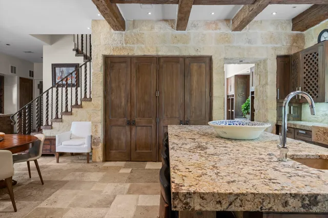 a view of a hallway with dining area and entryway