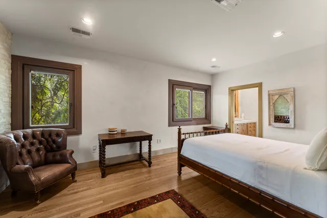 a bedroom with a bed and a couch