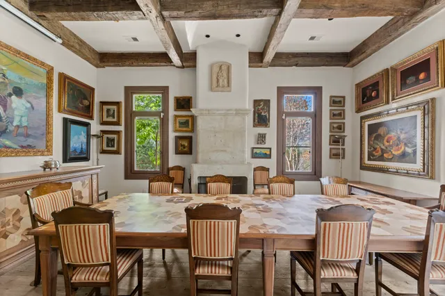 a dining room with furniture and window