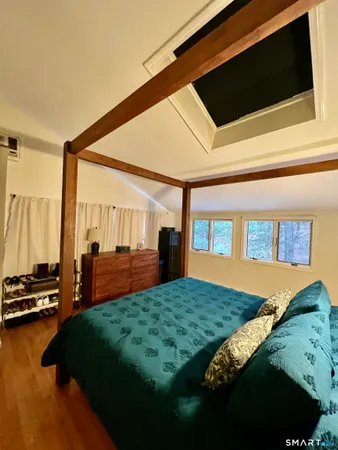 a spacious bathroom with a double vanity sink a mirror and a shower