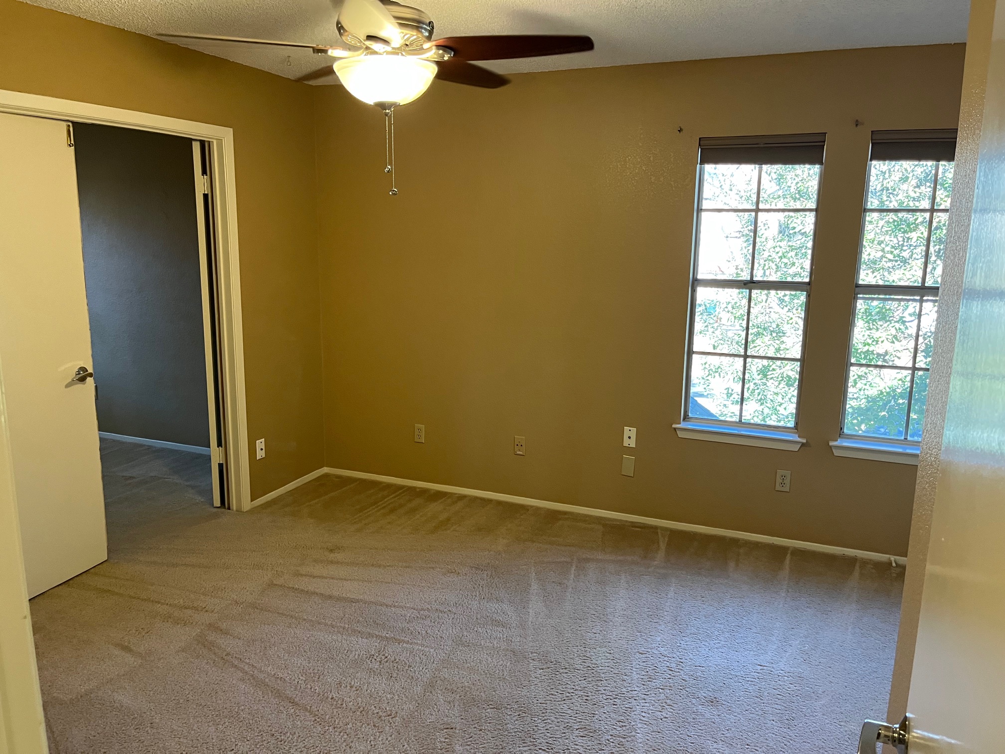 12919 Marimba Trail Austin, TX 78729 - Photo 13 of 20 Spare room with ceiling fan and light carpet