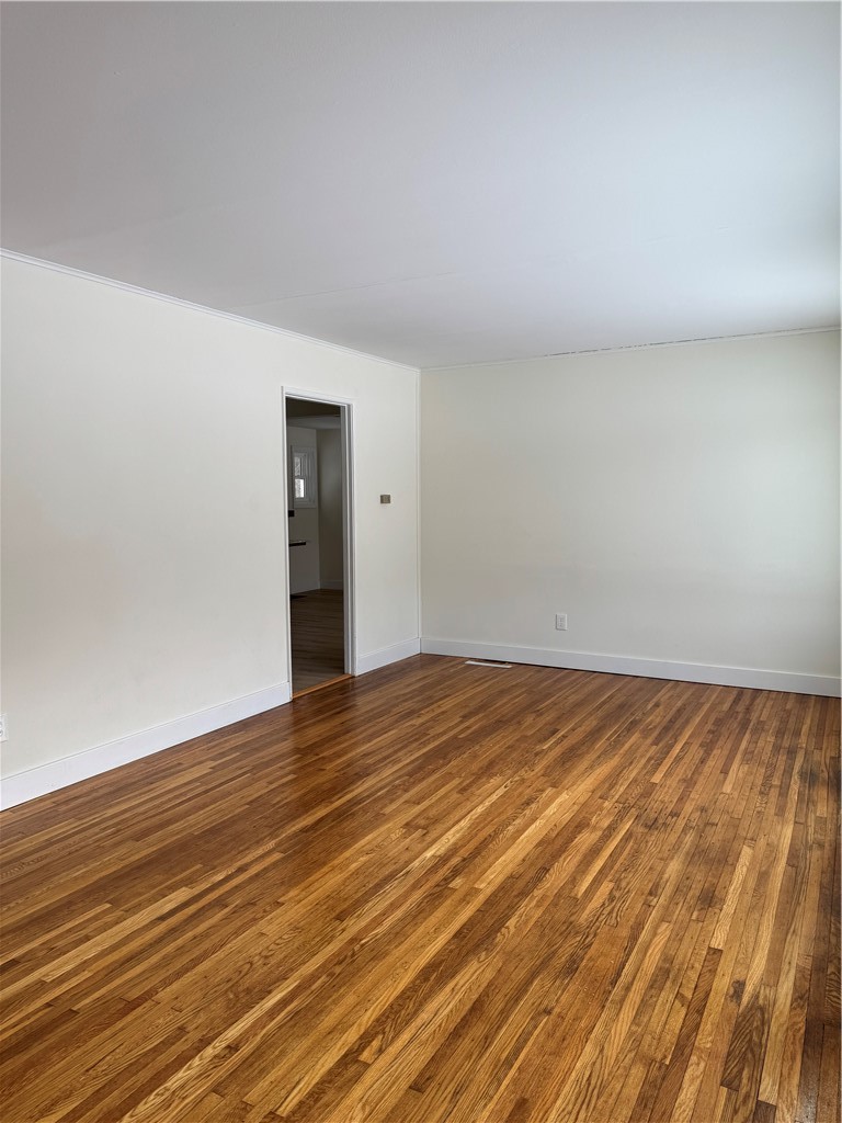 8 Finucane Road Henrietta, NY 14623 - Photo 13 of 30 Spacious living room leading to the kitchen