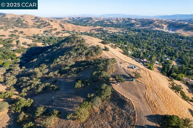 a view of mountain with an ocean