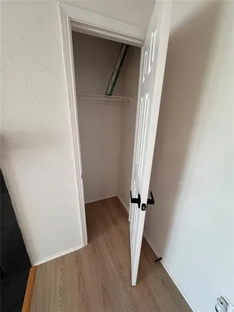 a kitchen with a sink and a refrigerator