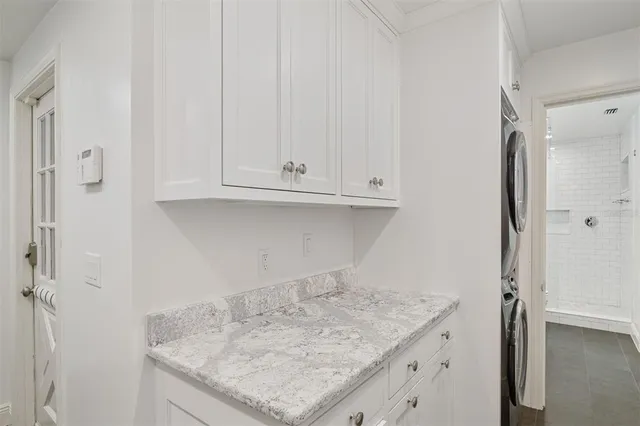 a bathroom with a shower and a sink