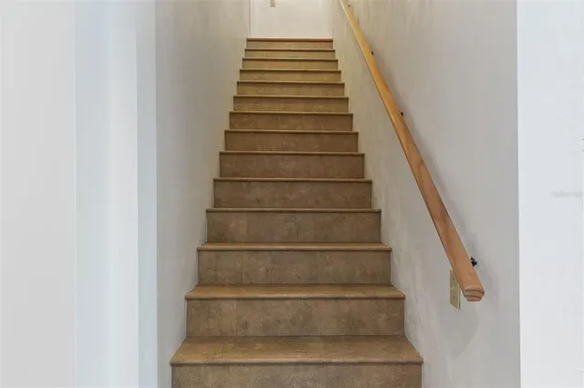 a bedroom with a large bed and a fireplace