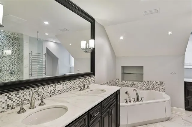 a living room with a bed furniture and a window