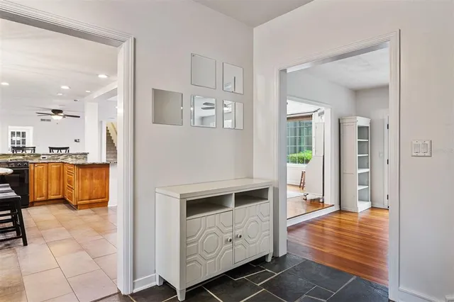 a bathroom with a granite countertop sink and a window