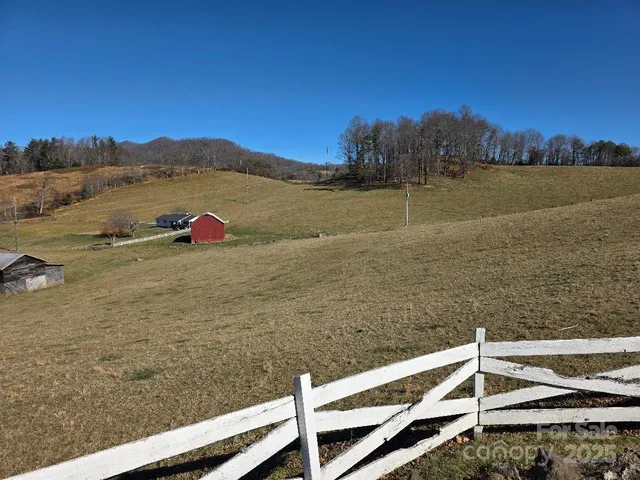 a view of an ocean with a mountain in the background