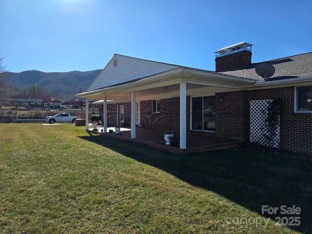 a view of a house with backyard porch and garden
