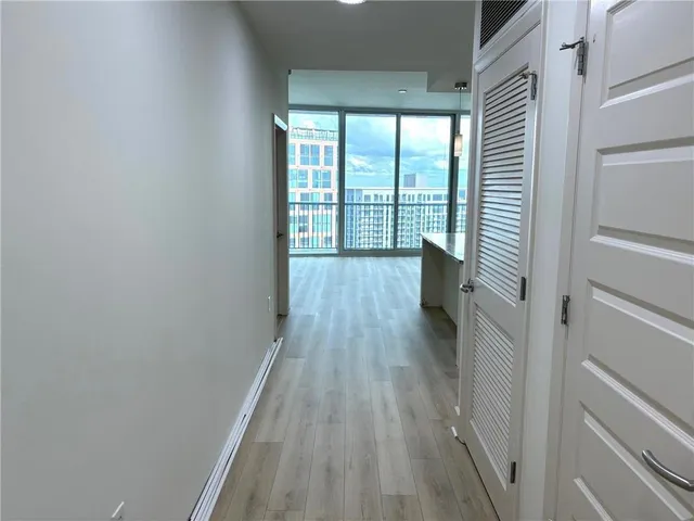 a view of entryway with wooden floor and furniture